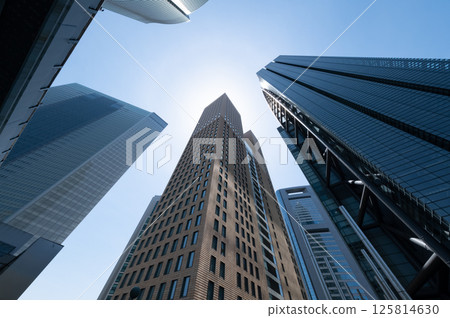 Skyscrapers towering over the blue sky Skyscrapers towering over the blue sky 125814630