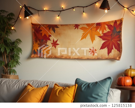 A rustic Thanksgiving banner with autumn leaves adorns a living room wall, warm lighting, with copy space above for design elements. A rustic Thanksgiving banner with autumn leaves adorns a living room wall, warm lighting, with copy space above for design elements. 125815138