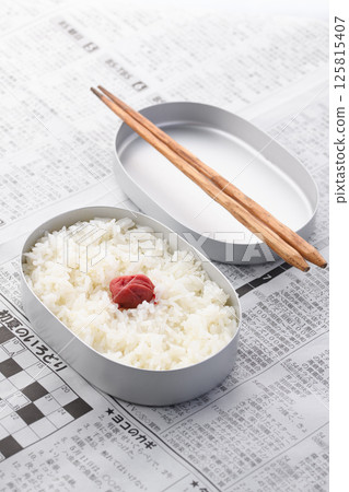 A Japanese flag lunch in an aluminum lunch box 125815407