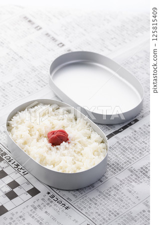 A Japanese flag lunch in an aluminum lunch box 125815409