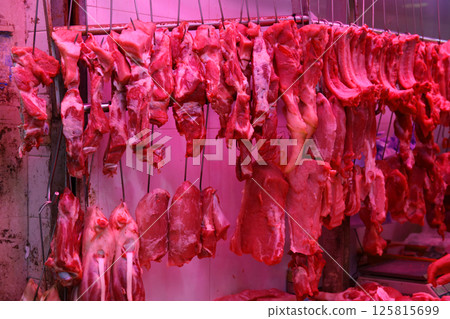 Pork sold at a butcher shop in the Hong Kong market. Higher and more expensive than beef and chicken. Chinese love pork Pork sold at a butcher shop in the Hong Kong market. Higher and more expensive than beef and chicken. Chinese love pork 125815699