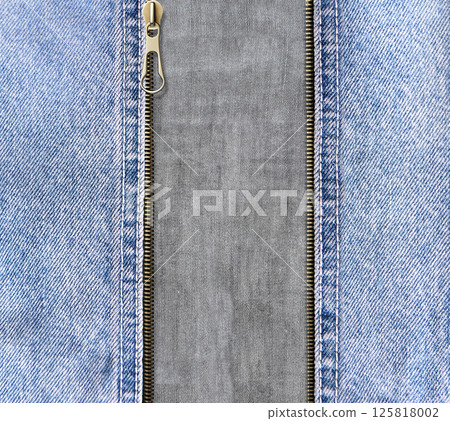 Square background with blue denim borders, zipper opened and gray cotton texture. Decorative backdrop with Unzipped zipper or fastener, light blue and gray color jeans fabric. Copy space for text Square background with blue denim borders, zipper opened and gray cotton texture. Decorative backdrop with Unzipped zipper or fastener, light blue and gray color jeans fabric. Copy space for text 125818002