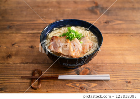 Okinawa soba topped with miso-marinated pork Okinawa soba topped with miso-marinated pork 125818395