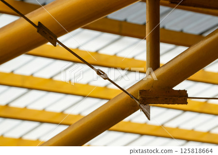 Modern Translucent Roof Structure with Yellow Steel Beams Modern Translucent Roof Structure with Yellow Steel Beams 125818664