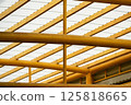 Modern Translucent Roof Structure with Yellow Steel Beams 125818665