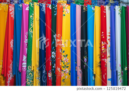 colorful silk scarves at Asian textile market in Vietnam close-up 125819472