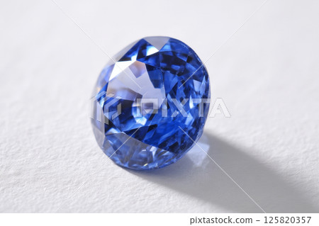 Blue sapphire gemstone on white background 125820357
