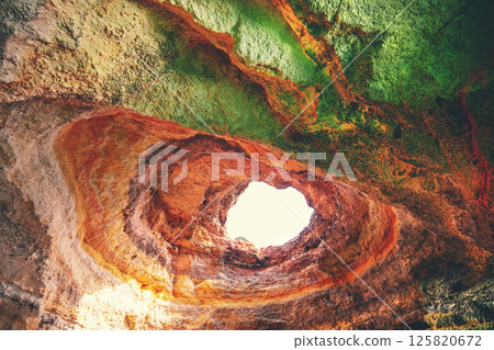 Coastal rocky seascape, hole of Benagil cave in Algarve region in Atlantic ocean, Portugal, Europe Coastal rocky seascape, hole of Benagil cave in Algarve region in Atlantic ocean, Portugal, Europe 125820672