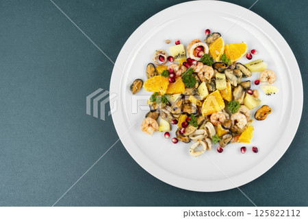Fresh salad with seafood. 125822112