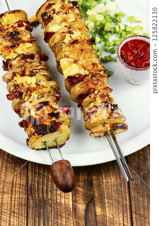 Grilled vegetable skewers with a spicy sauce. Grilled vegetable skewers with a spicy sauce. 125822130