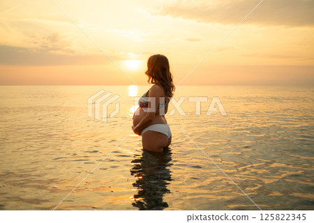 Woman Expecting Her Future Baby At The Sea  125822345