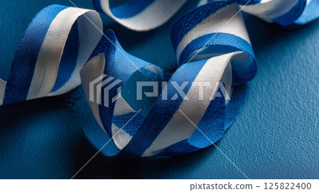 Bent ribbon flag of Israel showcasing blue and white hues with artistic flair 125822400
