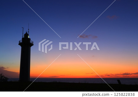 Landscape with a lighthouse at dusk Landscape with a lighthouse at dusk 125822838