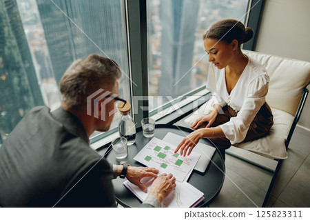 A Professional Meeting is Set to Take Place with the Business Team in a Modern Office Environment A Professional Meeting is Set to Take Place with the Business Team in a Modern Office Environment 125823311