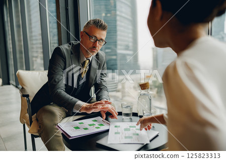 A business meeting in a modern office promotes collaboration and teamwork for common goals 125823313