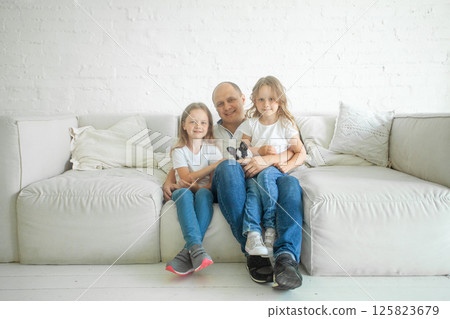 Smiling family. Man and children at home Smiling family. Man and children at home 125823679