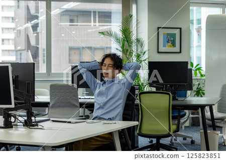 Tired businessman in the office Tired businessman in the office 125823851