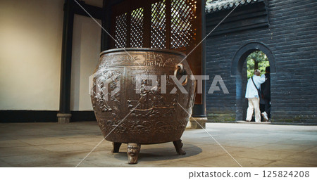 Chengdu, Sichuan, China. Ornate Iron Pot And Liu Bei Statue, Wuhou Memorial, Three Kingdoms Temple. Engraving On Bronze Incense Burial Pot In Mausoleum Chengdu, Sichuan, China. Ornate Iron Pot And Liu Bei Statue, Wuhou Memorial, Three Kingdoms Temple. Engraving On Bronze Incense Burial Pot In Mausoleum 125824208