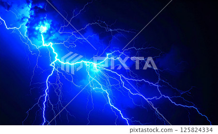 Intense blue lightning strikes illuminate dark night sky, creating dynamic energy crackle effect that captivates viewer with its powerful display Intense blue lightning strikes illuminate dark night sky, creating dynamic energy crackle effect that captivates viewer with its powerful display 125824334