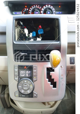 A photo of the car navigation system removed from the dashboard of a private car A photo of the car navigation system removed from the dashboard of a private car 125824432