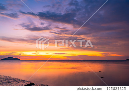 Nature beautiful light sunset or sunrise over sea surface,Colorful sunset sky with clouds and waves in the ocean,Wide angle sea background Nature beautiful light sunset or sunrise over sea surface,Colorful sunset sky with clouds and waves in the ocean,Wide angle sea background 125825825