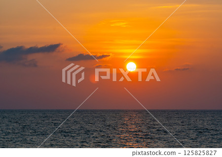Nature beautiful light sunset or sunrise over sea surface,Colorful sunset sky with clouds and waves in the ocean,Wide angle sea background Nature beautiful light sunset or sunrise over sea surface,Colorful sunset sky with clouds and waves in the ocean,Wide angle sea background 125825827