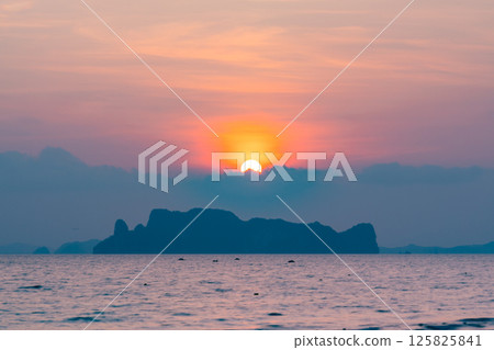 Nature beautiful light sunset or sunrise over sea surface,Colorful sunset sky with clouds and waves in the ocean,Wide angle sea background 125825841