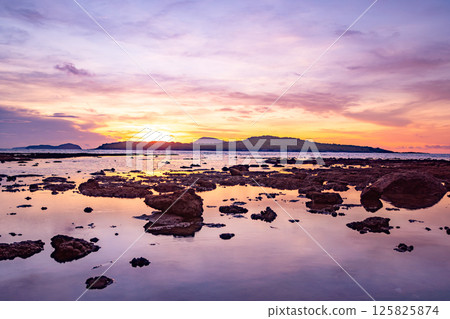 Nature beautiful light sunset or sunrise over sea surface,Colorful sunset sky with clouds and waves in the ocean,Wide angle sea background 125825874