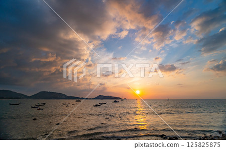 Nature beautiful light sunset or sunrise over sea surface,Colorful sunset sky with clouds and waves in the ocean,Wide angle sea background 125825875
