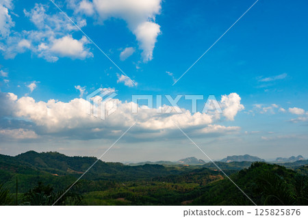 Landscape nature view blue sky white clouds over mountains in good weather day Landscape nature view blue sky white clouds over mountains in good weather day 125825876