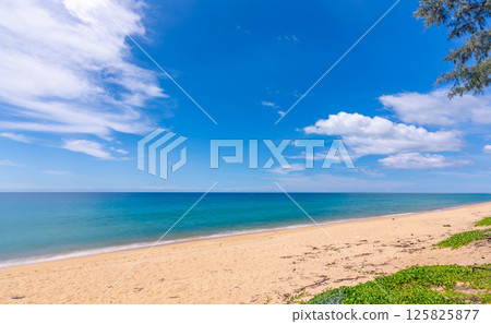 Beautiful sandy beach and sea in sunny day,Blue sky in good weather day, Beach sea space area nature background 125825877