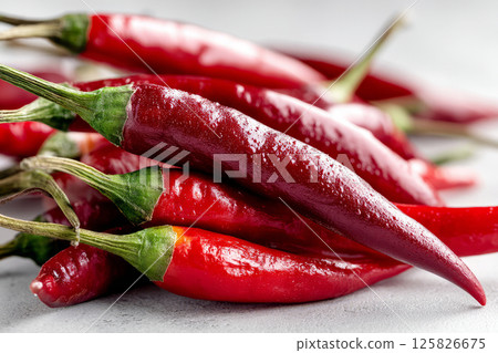 Fresh red chili peppers with water drops 125826675