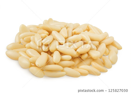 Shelled European pine nuts isolated on white background with full depth of field Shelled European pine nuts isolated on white background with full depth of field 125827030