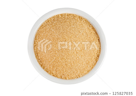 The brown sugar in ceramic bowl isolated on white background. Top view. Flat lay The brown sugar in ceramic bowl isolated on white background. Top view. Flat lay 125827035