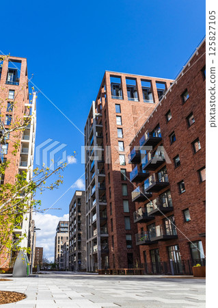 Residential cityscape featuring red brick buildings 125827105