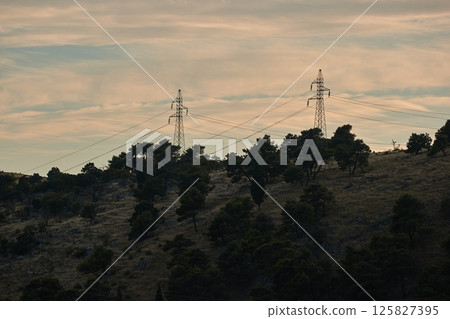 Power lines on a hill 125827395