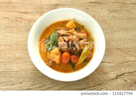 spicy boiled roasted duck meat with pineapple and tomato in coconut milk curry soup on bowl spicy boiled roasted duck meat with pineapple and tomato in coconut milk curry soup on bowl 125827794
