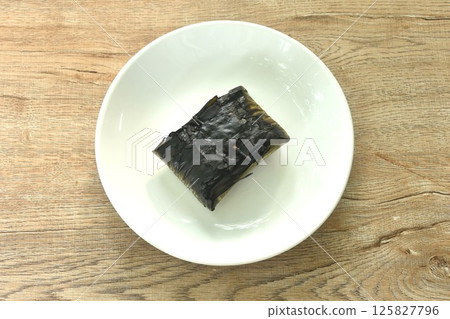 grilled chop pork curry in banana leave Thai northern food on plate 125827796