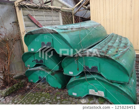 [Lithuania] Green boats stacked on the ground (Trakai) 125828451