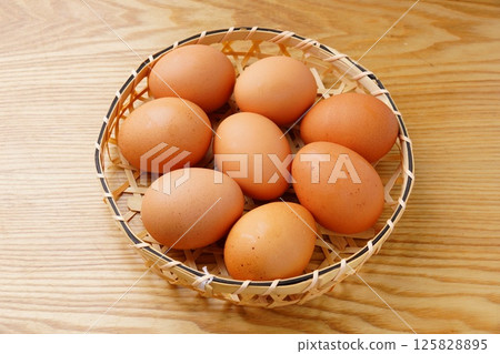 Raw red egg Raw red egg 125828895