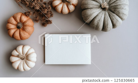 Autumn Composition with Pumpkins and Blank Card on Neutral Background 125830665