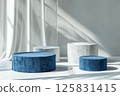 3D rendering of blue and white podiums with round shapes on an isolated background, in a minimalist style with a blue color theme, professional photoshoot for an advertising campaign 125831415