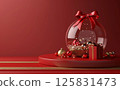 3D rendering of a Christmas decoration inside a glass ball with a gift box on a red background, a podium for product presentation. A New Year's atmosphere. 125831473