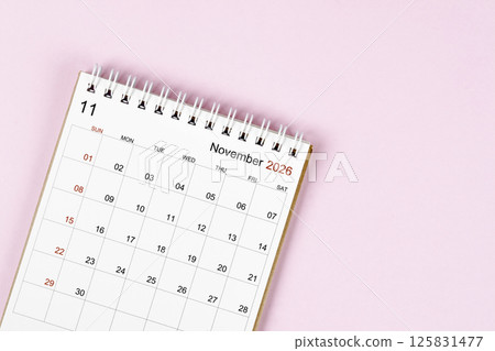 November 2026 desk calendar on pink background, Position with empty space. November 2026 desk calendar on pink background, Position with empty space. 125831477