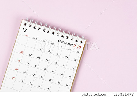 December 2026 desk calendar on pink background, Position with empty space. December 2026 desk calendar on pink background, Position with empty space. 125831478