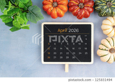 April 2026 calendar decorated with pumpkin and green leaves. April 2026 calendar decorated with pumpkin and green leaves. 125831494