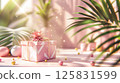 3D rendering of a gift box podium background with a pastel pink color, geometric shapes, and palm leaf decorations for a birthday party or special event 125831599
