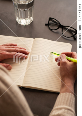 Close up image of woman writing something in personal diary. Psychological concept. Putting all thoughts on paper. 125831763