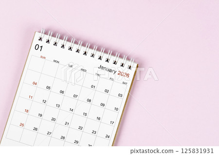 January 2026 desk calendar on pink background, Position with empty space. January 2026 desk calendar on pink background, Position with empty space. 125831931