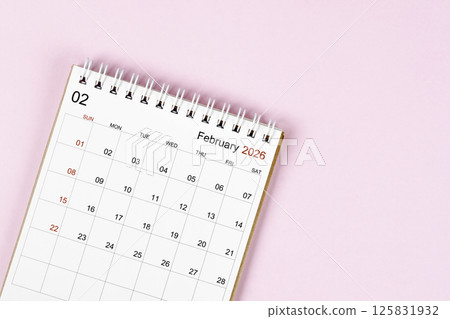 February 2026 desk calendar on pink background, Position with empty space. February 2026 desk calendar on pink background, Position with empty space. 125831932